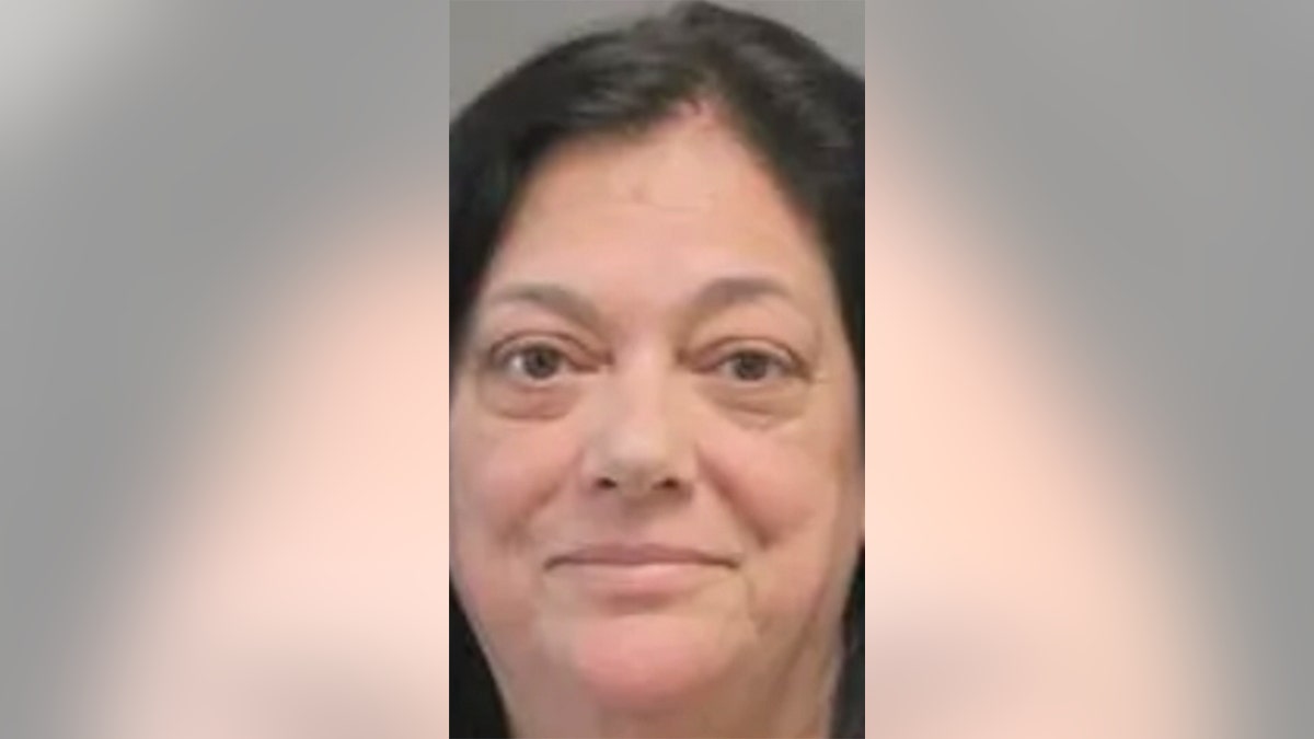 Donna Cipley, 63, used her door to hit a police officer then bent back the thumb of another while being arrested for criminal contempt, authorities say