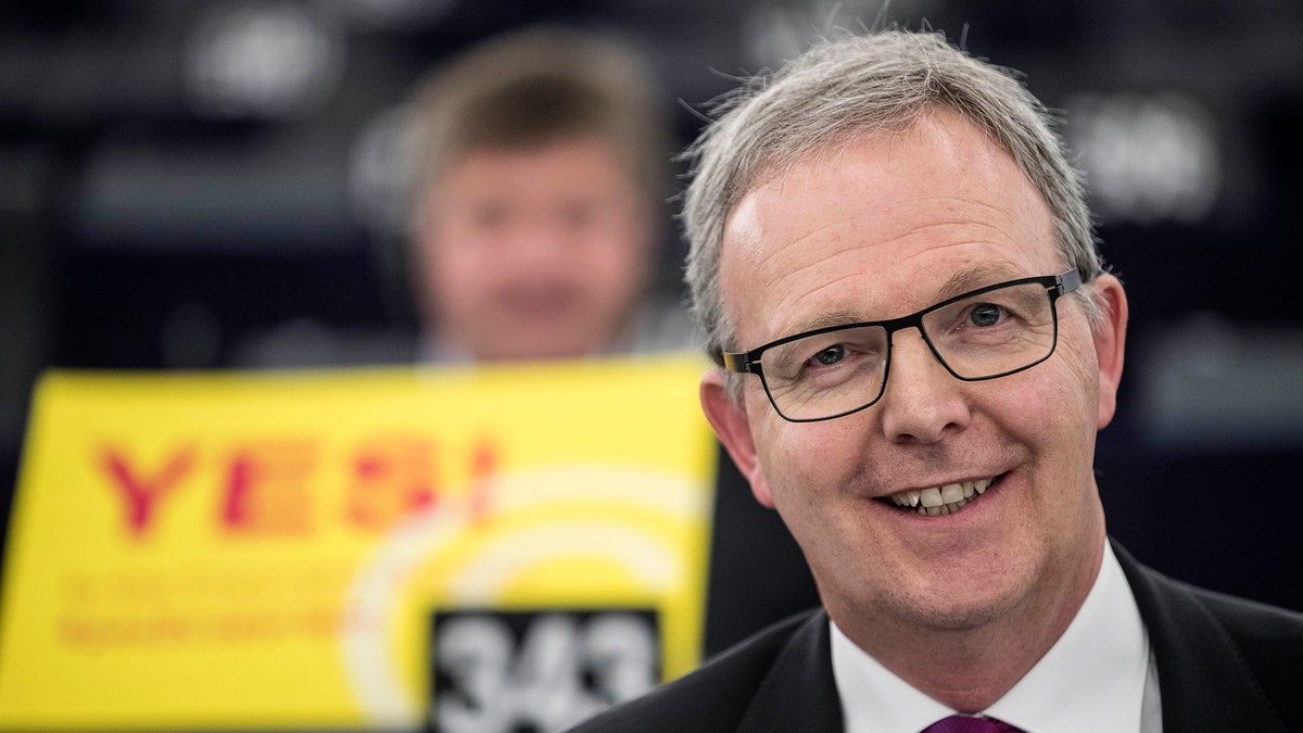 Axel Voss, Member of the European Parliament and rapporteur of the copyright bill, poses for the media at the European Parliament in Strasbourg, France, Tuesday March 26, 2019. The European Parliament is furiously debating the pros and cons of a landmark copyright bill one last time before the legislature will vote on it later. (AP Photo/Jean-Francois Badias)