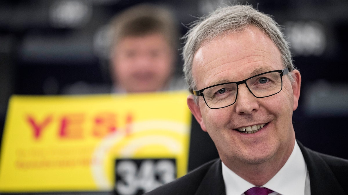Axel Voss, Member of the European Parliament and rapporteur of the copyright bill, poses for the media at the European Parliament in Strasbourg, France, Tuesday March 26, 2019. The European Parliament is furiously debating the pros and cons of a landmark copyright bill one last time before the legislature will vote on it later. (AP Photo/Jean-Francois Badias)