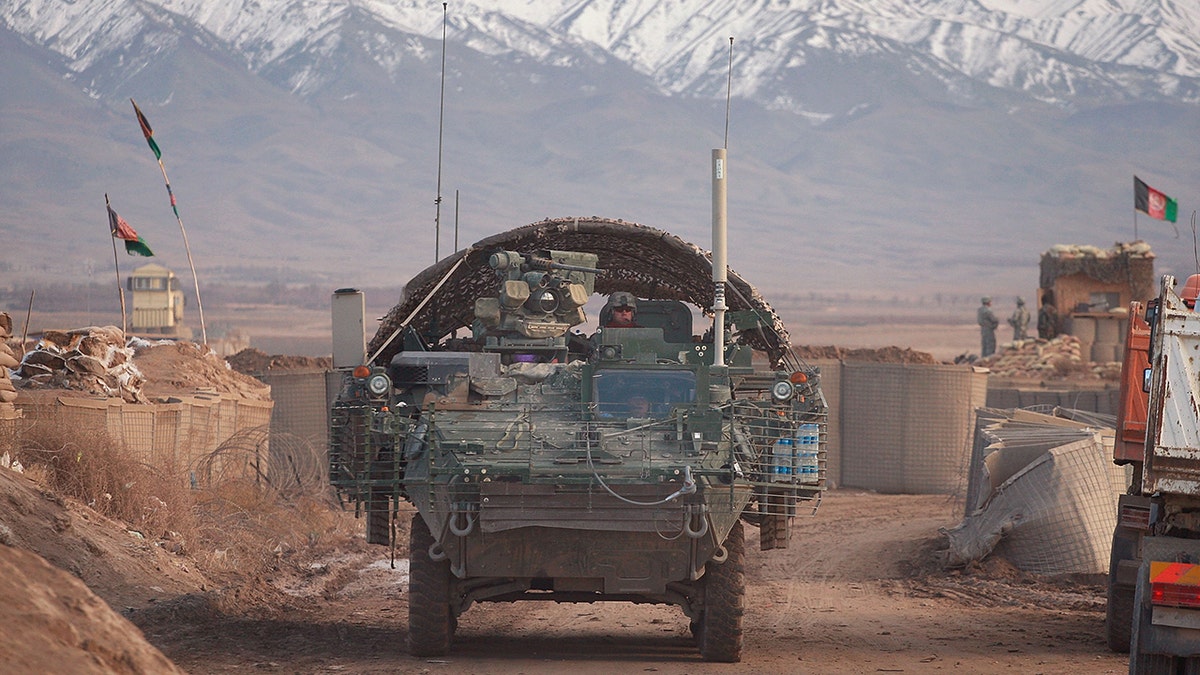 A Stryker armored combat vehicle leaving on a mission from Forward Operating Base Wolverine in December 2009 near Qalat, Afghanistan. Mullah Omar, former leader of the Taliban, reportedly was living near the base for years before his death.