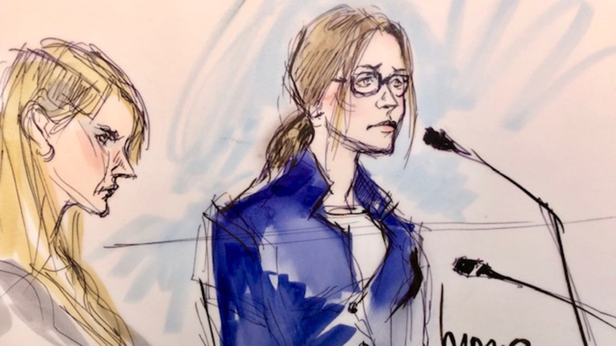 Felicity Huffman, right, appears in this court sketch at an initial hearing for defendants in a racketeering case involving the allegedly fraudulent admission of children to elite universities, at the U.S. federal courthouse in downtown Los Angeles, Calif. 