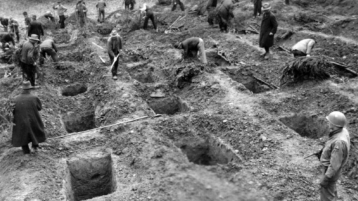 File photo - The reburial of the massacre victims supervised by U.S. forces.