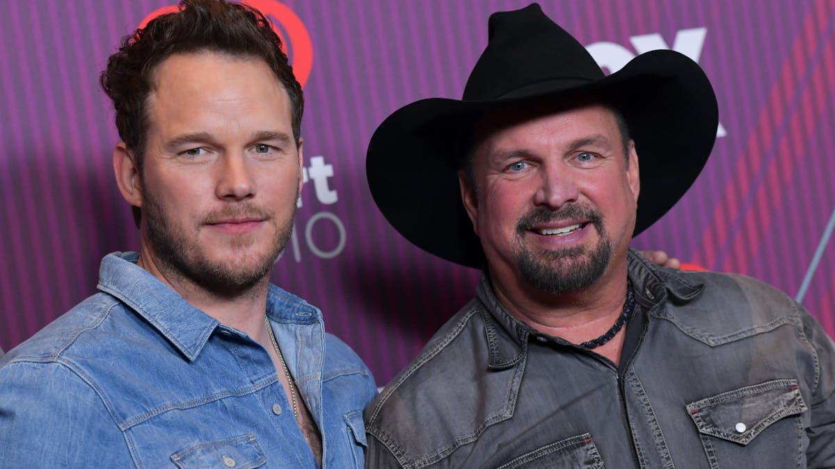 Garth Brooks and Chris Pratt pose in the press room during the 2019 iHeart Radio Music Awards in Los Angeles on Thursday.