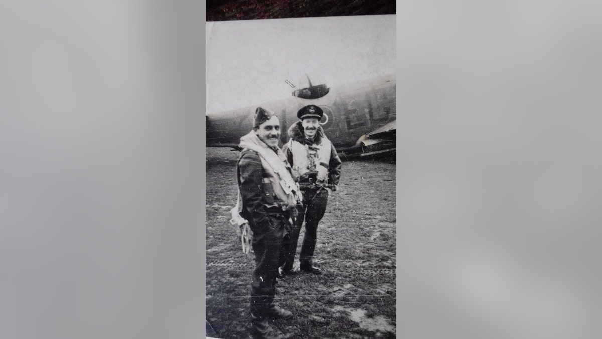 Phillips (left) and a fellow a fellow RAF officer with a Lockheed Martin Ventura aircraft in the background.(Hansons Auctioneers)