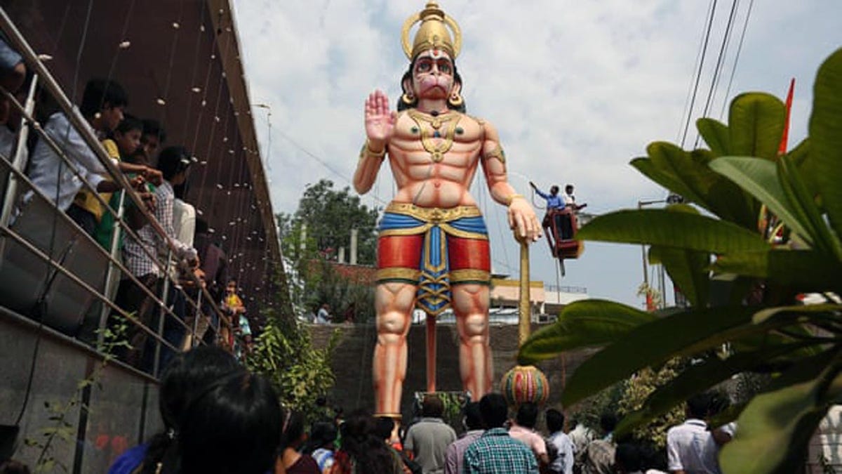 A statue of Hindu monkey-god Hanuman is washed during the birthday of Lord Hanuman in Hyderabad, India.