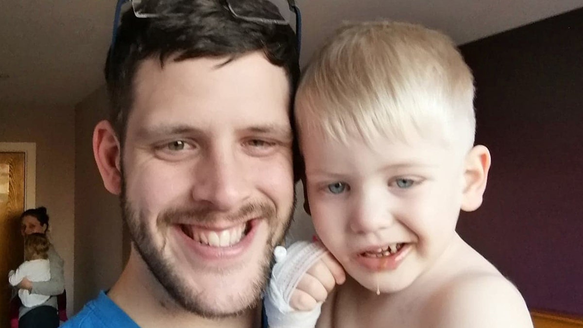 Wesley Lacey, 28, with his son Jack, said that they initially believed the boy's crooked smile was an imitation of someone else.