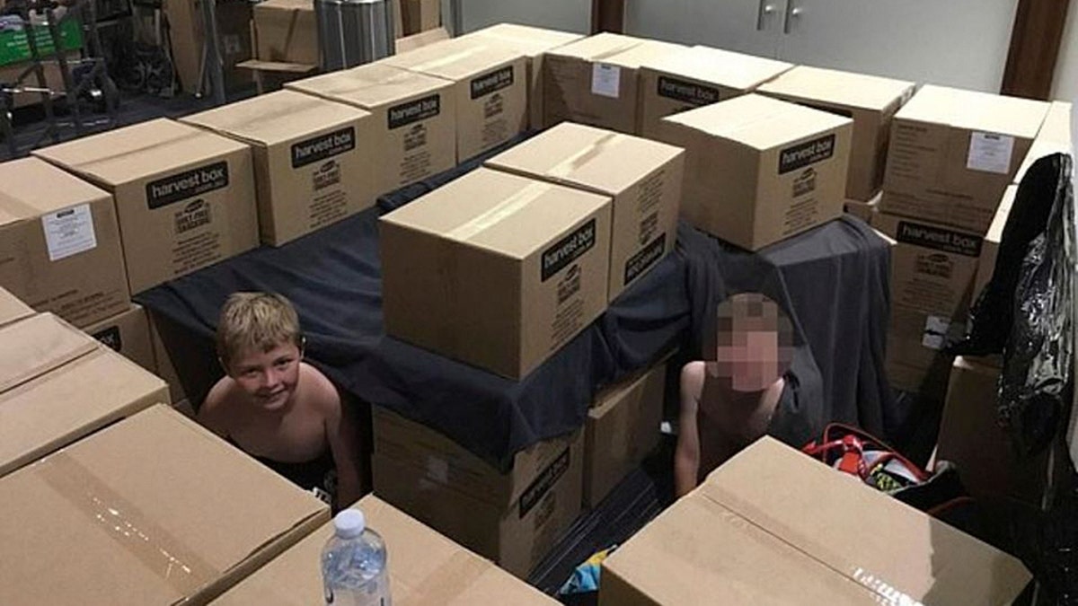 The boy, as well as other children, slept in the meeting room. Staffers had also reportedly supplied them with cardboard boxes for entertainment.