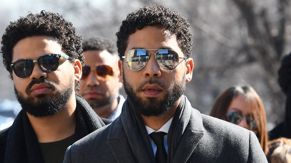 "Empire" actor Jussie Smollett, center, arrives at Leighton Criminal Court Building for a hearing to discuss whether cameras will be allowed in the courtroom during his disorderly conduct case on Tuesday, March 12, 2019, in Chicago. A grand jury indicted Smollett last week on 16 felony counts accusing him of lying to the police about being the victim of a racist and homophobic attack by two masked men in downtown Chicago.(AP Photo/Matt Marton)