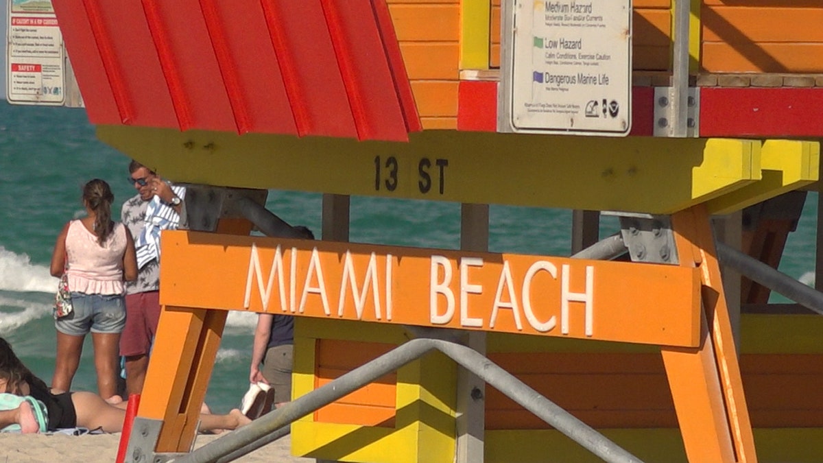 Miami Beach lifeguards watch over the beach scene