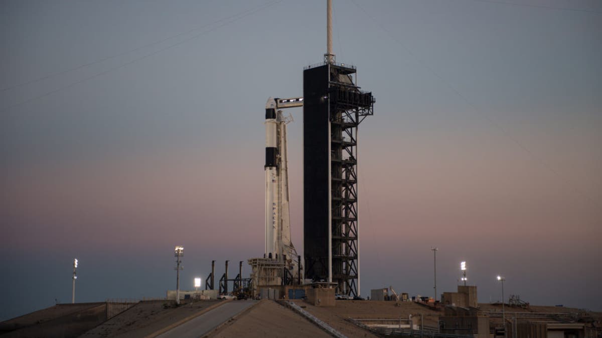The SpaceX Falcon 9 rocket with the Crew Dragon spacecraft onboard is seen after being raised into a vertical position on the launch pad at Launch Complex 39A Feb. 28, 2019.