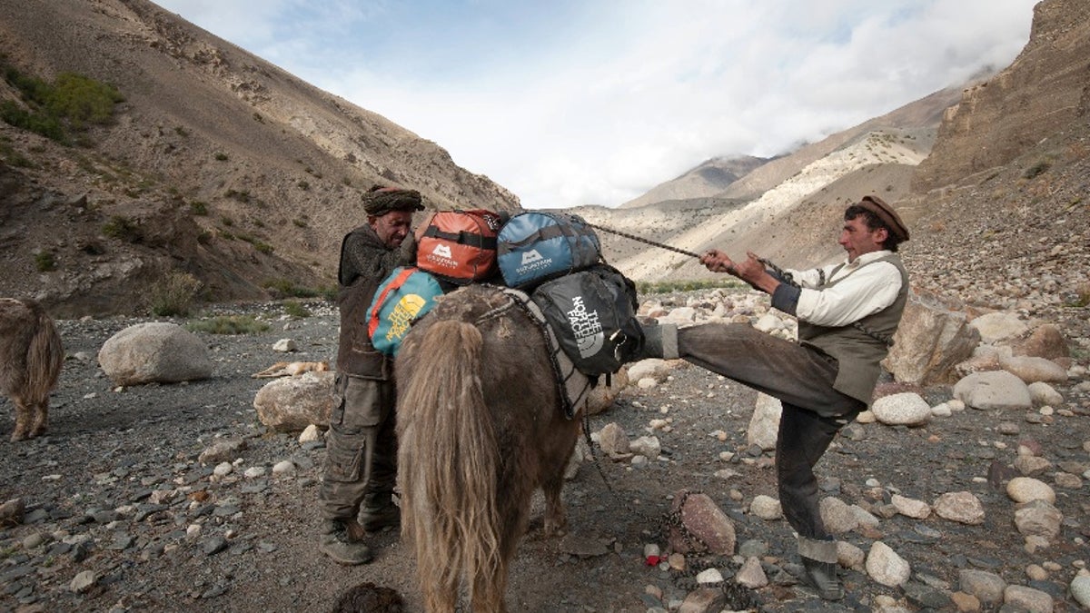 Afghanistan residents are seen packing a yak at the Wakhan Corridor.