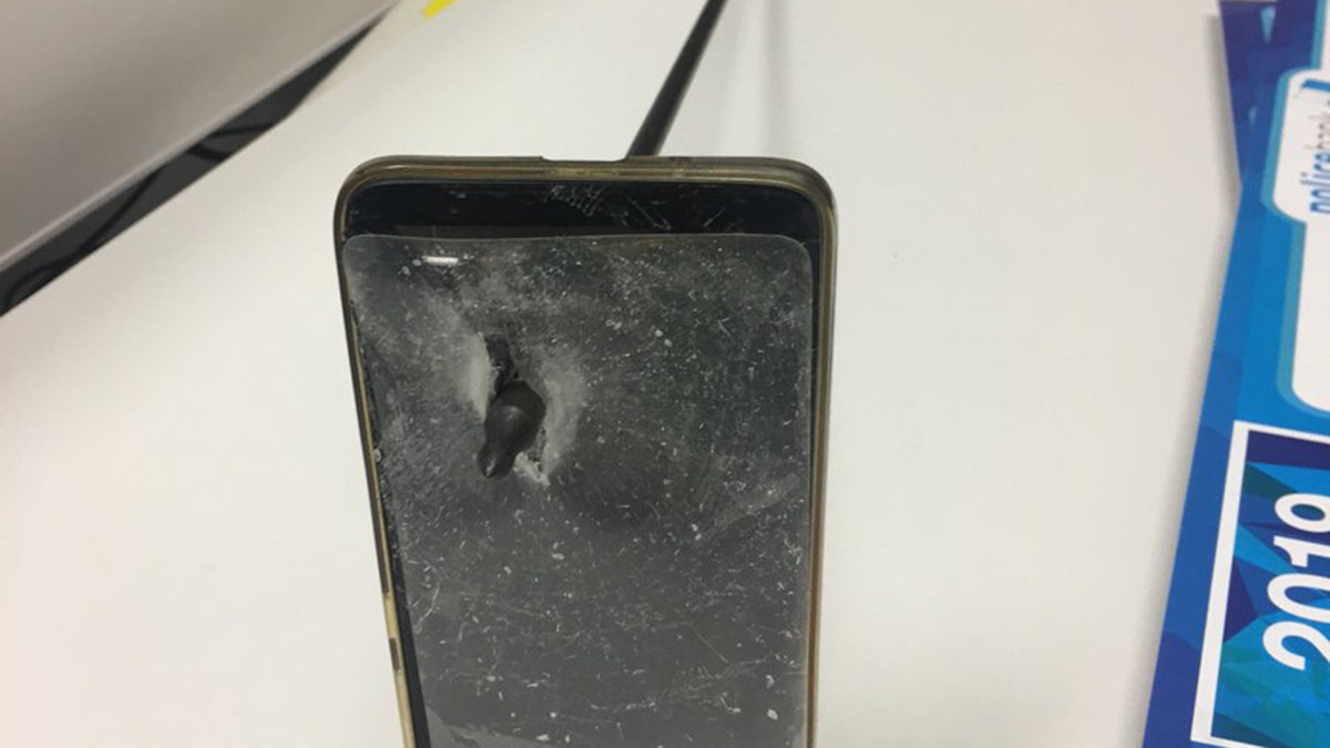 An Australian man was able to block an arrow from hitting him after his phone become a shield, police said. 