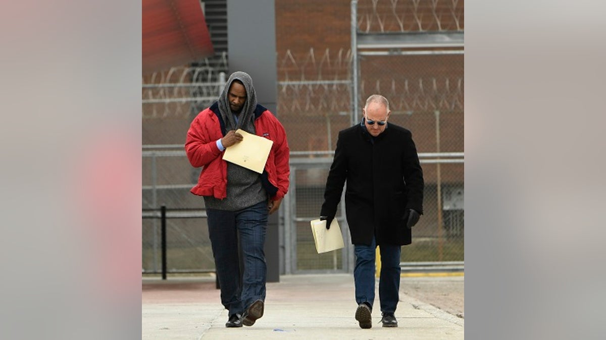 Singer R. Kelly left, walks with his attorney Steve Greenberg right, after being released from Cook County Jail, March 9, 2019, in Chicago. 