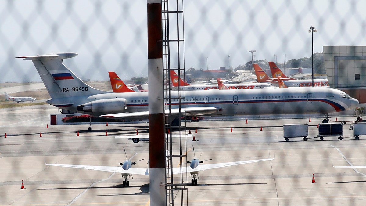 An airplane with the Russian flag is seen at Simon Bolivar International Airport in Caracas, Venezuela March 24, 2019. REUTERS/Carlos Jasso - RC13D63BF0B0