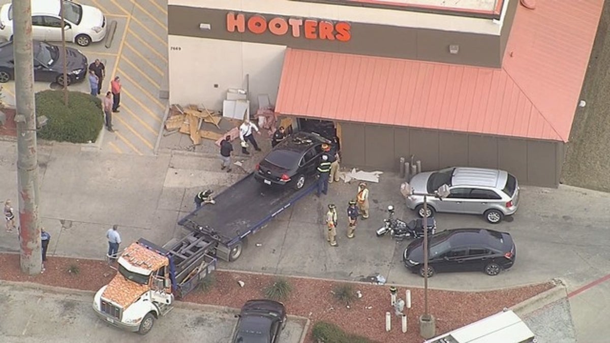 A car crash into a Hooters restaurant in North Richland Hills, Texas, on Friday.