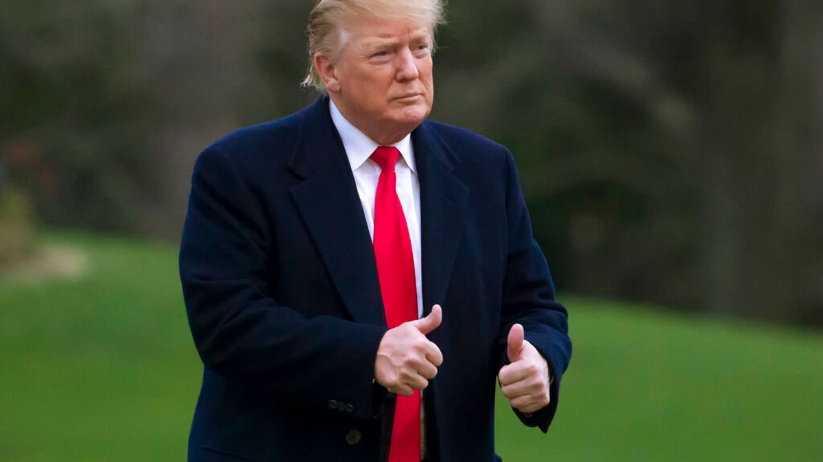 President Donald Trump gives two thumbs up after stepping off Marine One on the South Lawn of the White House, Sunday, March 24, 2019, in Washington. The Justice Department said Sunday that special counsel Robert Mueller's investigation did not find evidence that President Donald Trump's campaign "conspired or coordinated" with Russia to influence the 2016 presidential election. (AP Photo/Alex Brandon)