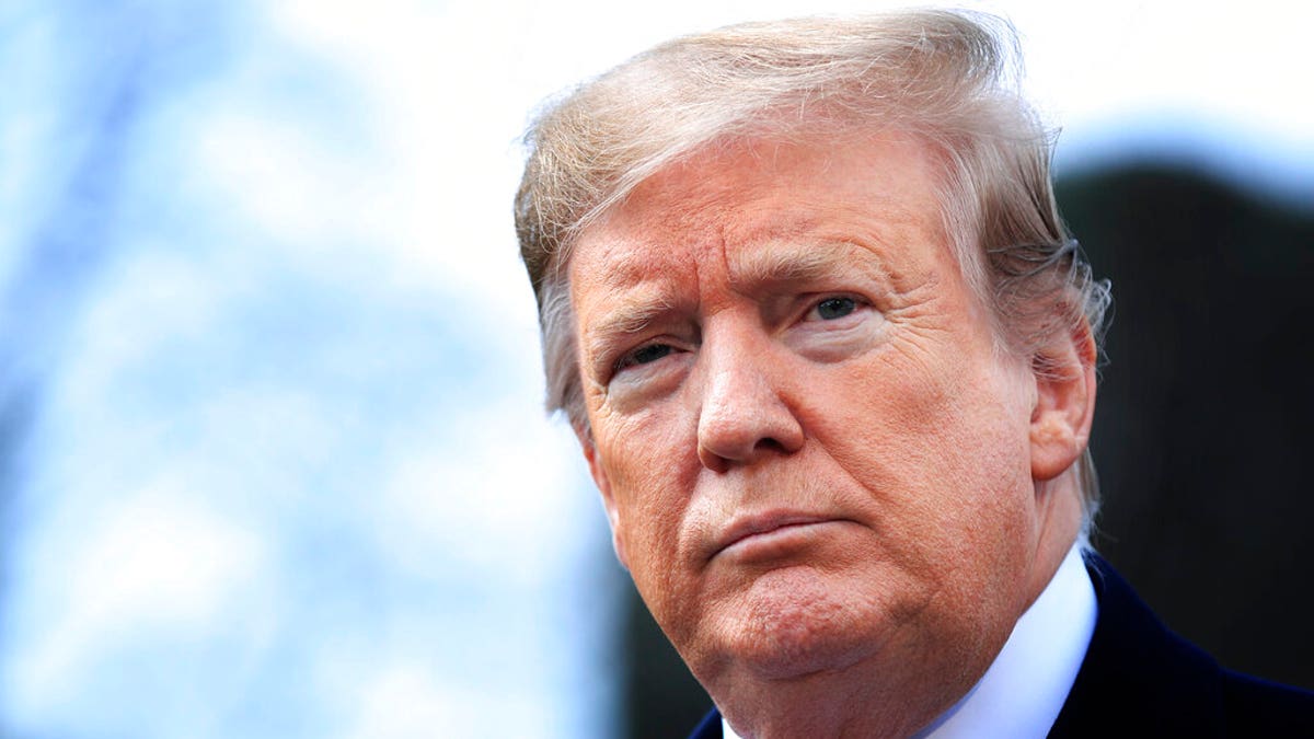 FILE - In this Wednesday, March 20, 2019 file photo, President Donald Trump speaks to reporters before leaving the White House in Washington, for a trip to visit a Army tank plant in Lima, Ohio, and a fundraising event in Canton, Ohio. Trump on Wednesday, March 27, 2019, will present his eighth Medal of Honor at the White House, to the family of Army Staff Sgt. Travis Atkins, who gave his life in 2007 to save fellow soldiers from an Iraqi suicide bomber. (AP Photo/Manuel Balce Ceneta, File)