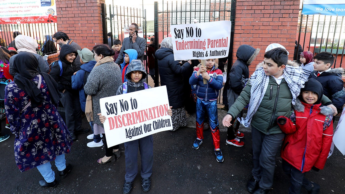The organizers accused gay assistant head Andrew Moffatt of promoting LGBT rights against the wishes of the parents, who carried placards reading “Say no to sexualizing children” and “respect and be respected.”