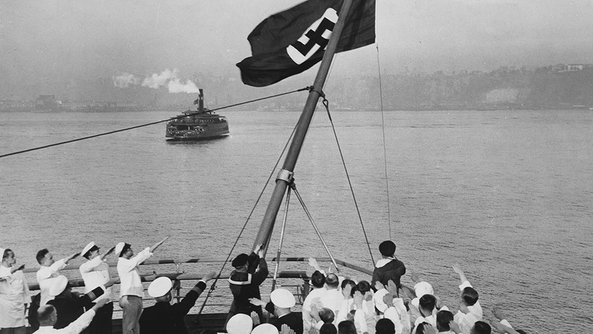 Flagship ceremony on Bremen in the port of New York. After the Reichsflaggengesetz adopted by the Reichstag, the German merchant flag was replaced by the Nazi flag. Photo by ullsteinbild via Getty Images)