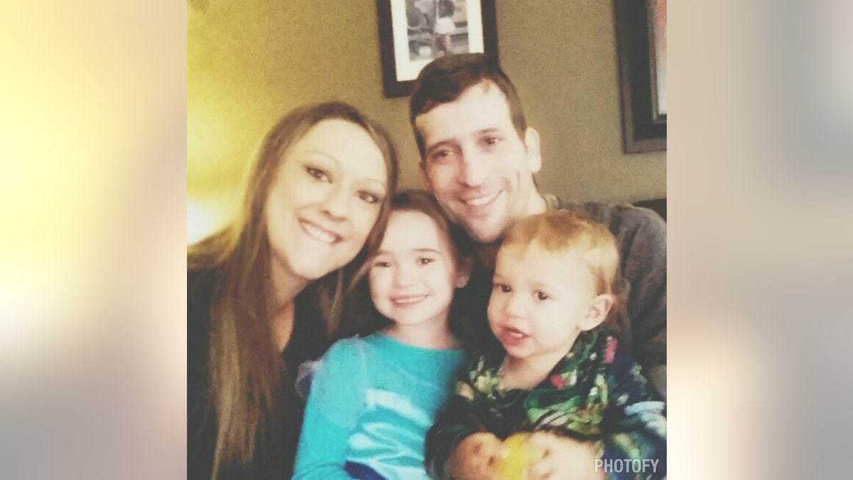 The couple, pictured with their two children, said they told the kids that they were both sick, but avoided using the word cancer.