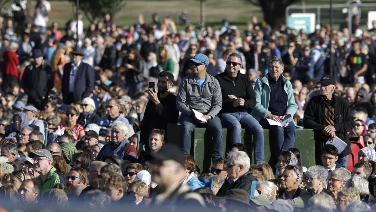 People listen during a National Remembrance Service in Hagley Park for the victims of the March 15 mosques terrorist attack in Christchurch, New Zealand, Friday, March 29, 2019.