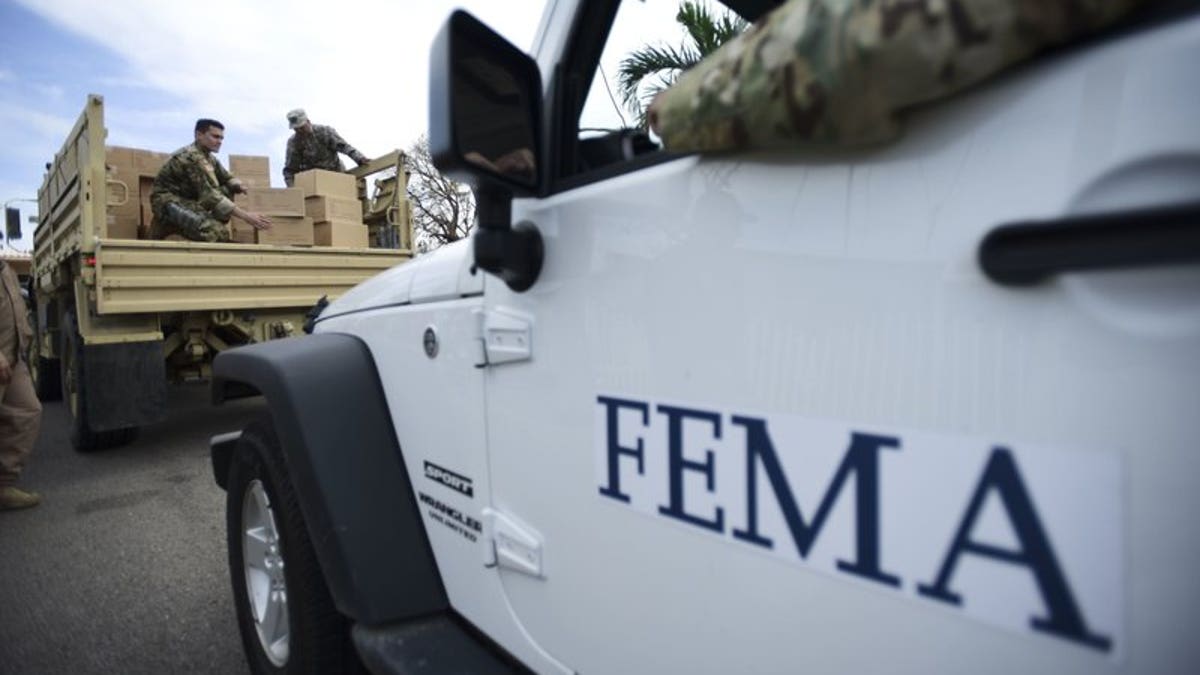 Federal Emergency Management Agency personnel deliver supplies in the aftermath of Hurricane Maria in Guayama, Puerto Rico, on Oct. 5, 2017.