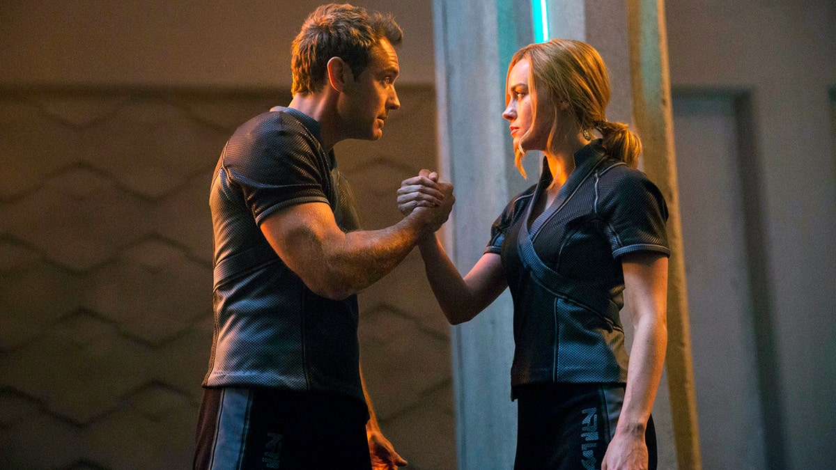 This image released by Disney-Marvel Studios shows Jude Law, left, and Brie Larson in a scene from 