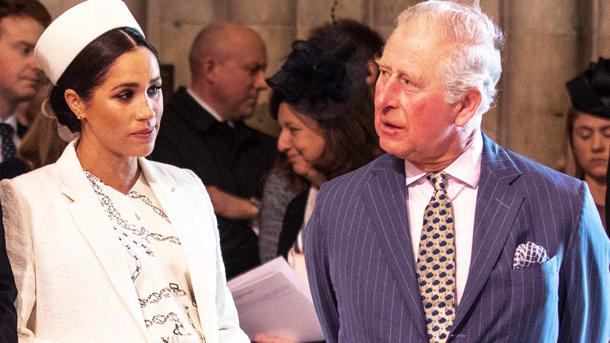 Britain's Meghan, Duchess of Sussex (2R) talks with Britain's Prince Charles, Prince of Wales (R).