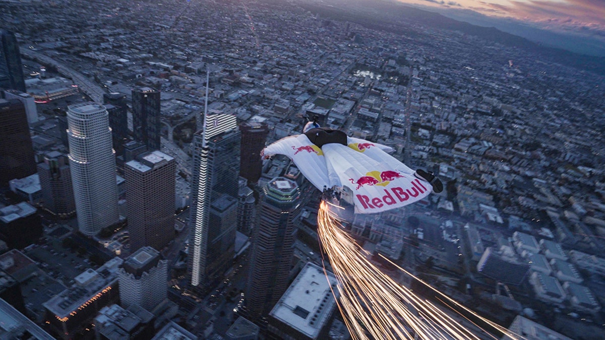 Jon Devore wingsuit flys past the Supermoon in Los Angeles, California, USA on 20 March, 2019.