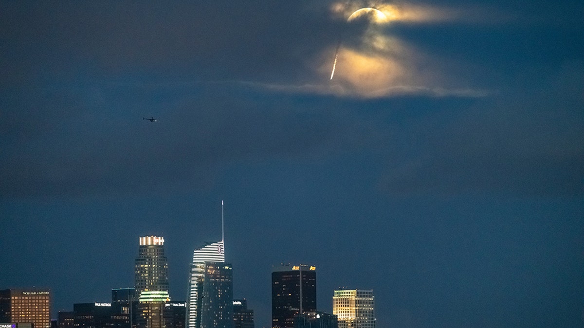 Mike Swanson in wingsuit flies through downtown Los Angeles on March 20, 2019.