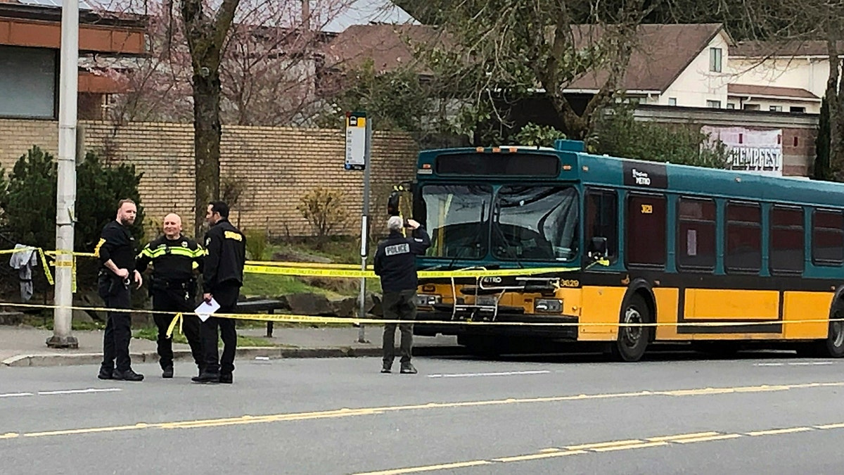 Investigators work at the scene of a shooting in Seattle on Wednesday, March 27, 2019. (Associated Press)