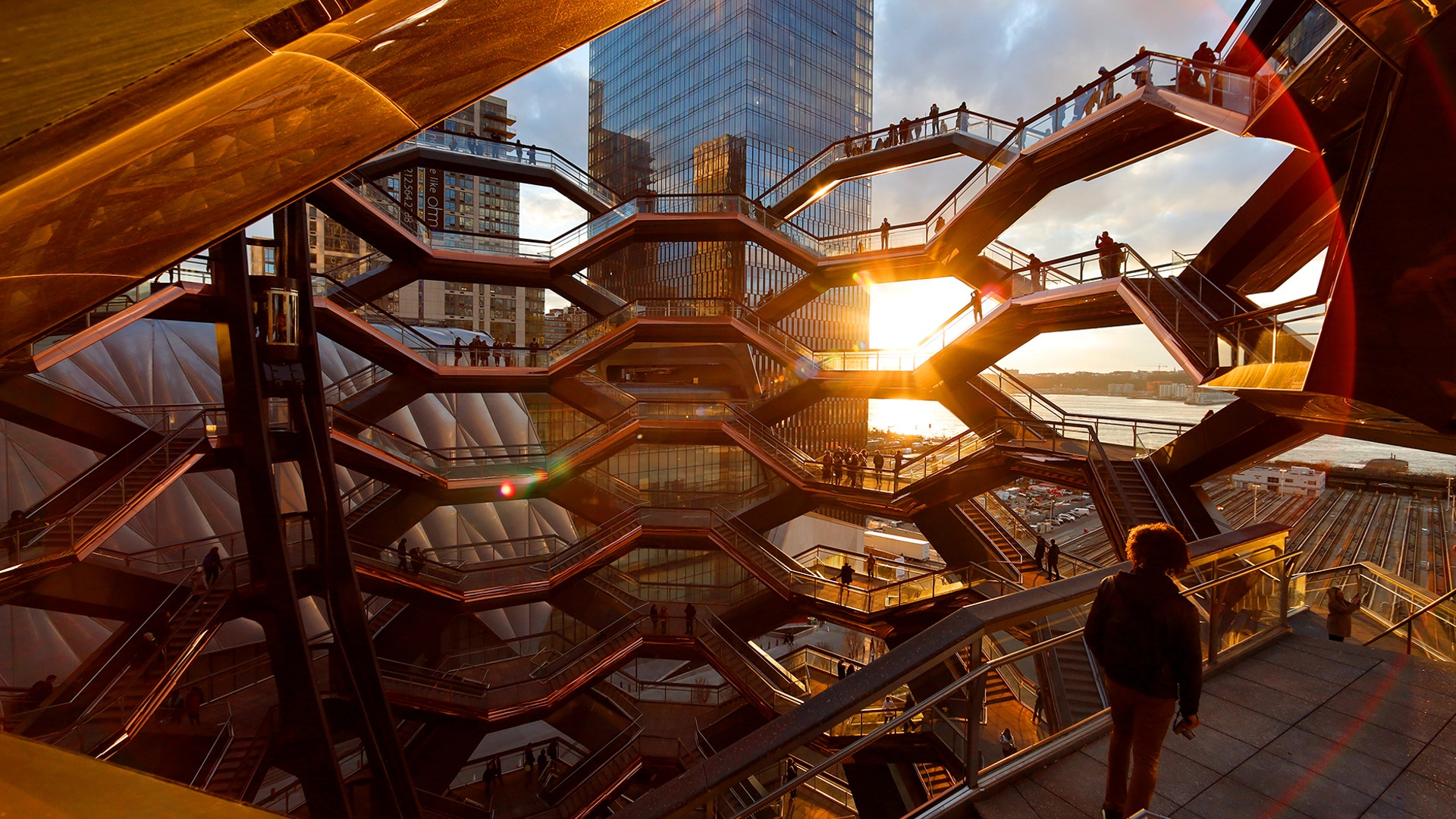 People stand on the Vessel at Hudson Yards a staircase sculpture designed by Thomas Heatherwick at sunset in New York City, March 18, 2019. 