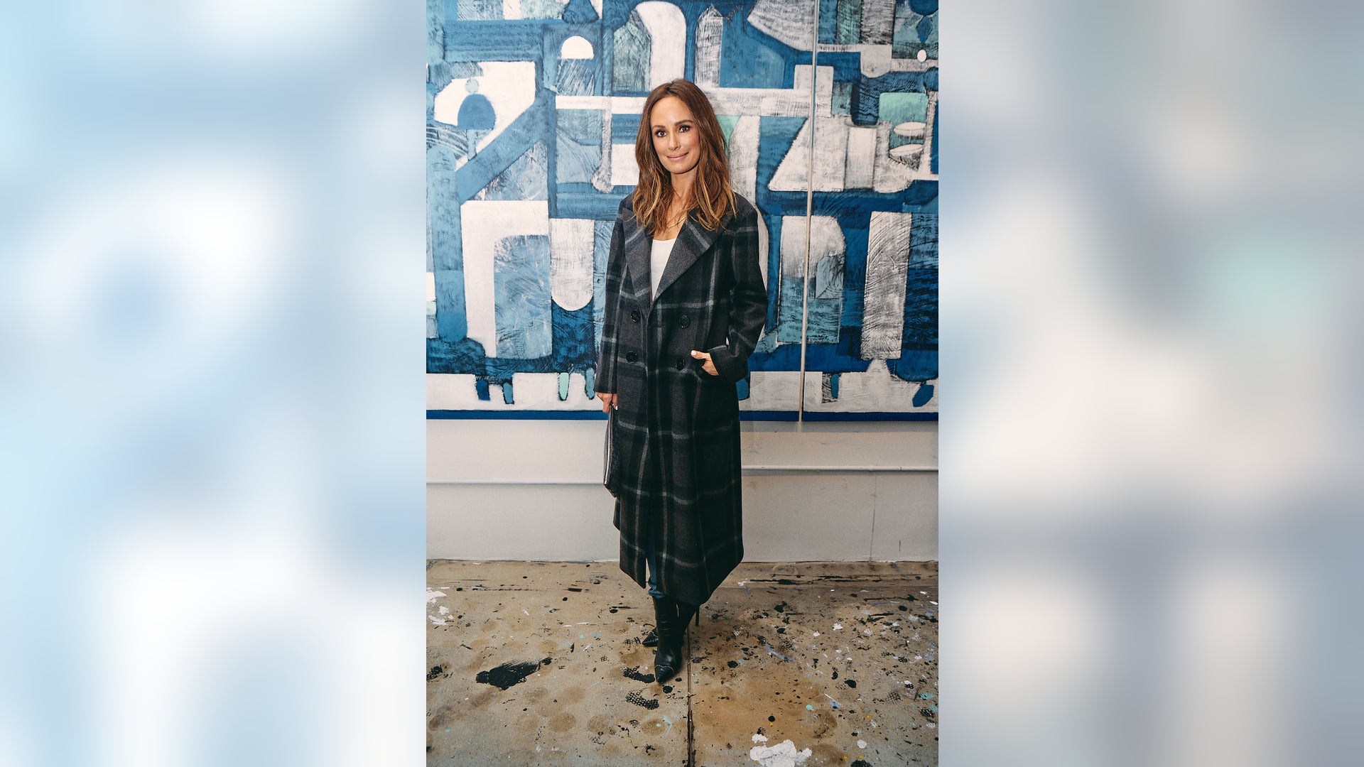 Catt Sadler looks casual chic in a flannel trench coat as she celebrates artist Marco Lorenzetto's studio opening in Hollywood, Calif. on March 21, 2019.