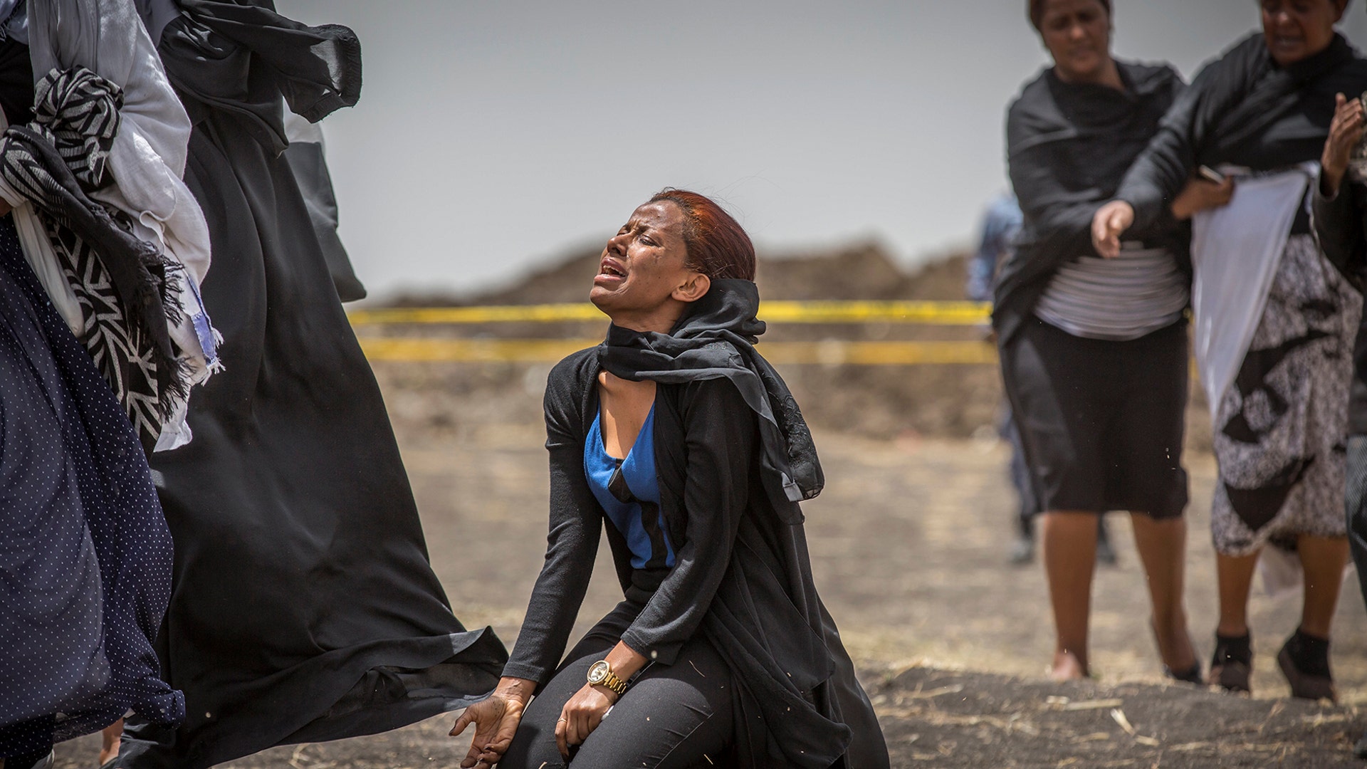 Ethiopian relatives of crash victims mourn and grieve at the scene where the Ethiopian Airlines Boeing 737 Max 8 crashed shortly after takeoff killing all 157 on board, near Bishoftu, in Ethiopia, March 14, 2019. 