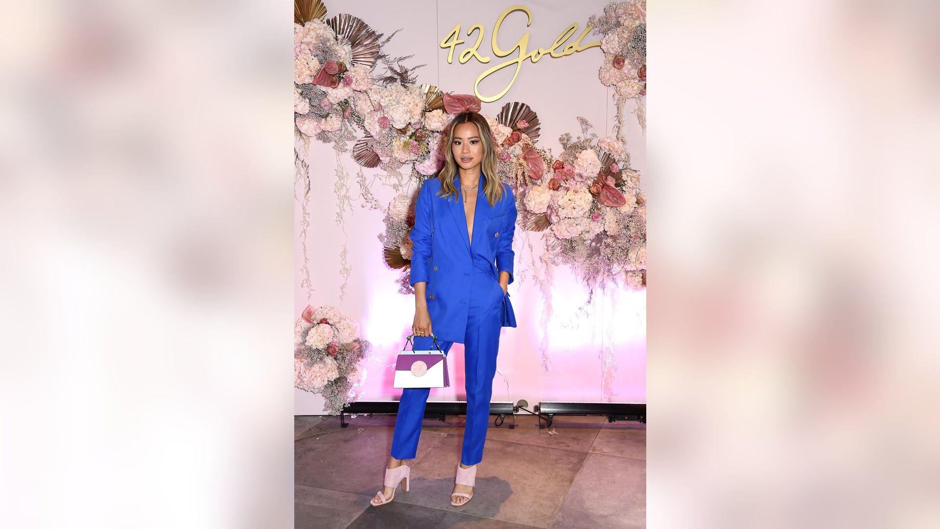 Jamie Chung stuns in a blue pantsuit as she poses during the celebration of her 42Gold collection with Chinese Laundry at LaPeer Hotel on March 20, 2019 in West Hollywood, Calif.
