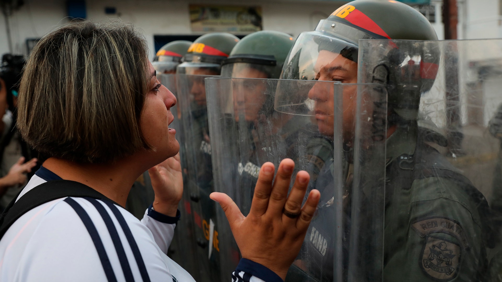 A demonstrator confronts a member of the Bolivarian National Guard in Urena, Venezuela, near the border with Colombia, Feb. 23, 2019. 