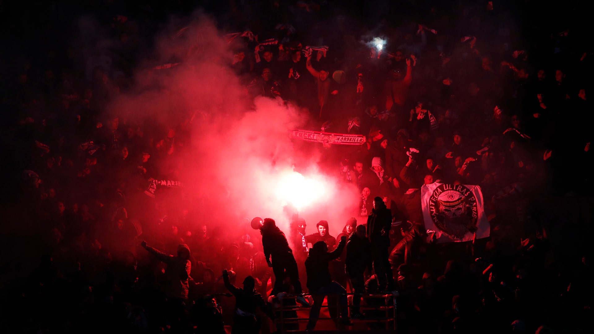 PSG supporters set off flares after their team scored during their French League One soccer match against Olympique Marseille in Paris, March 17, 2019. 