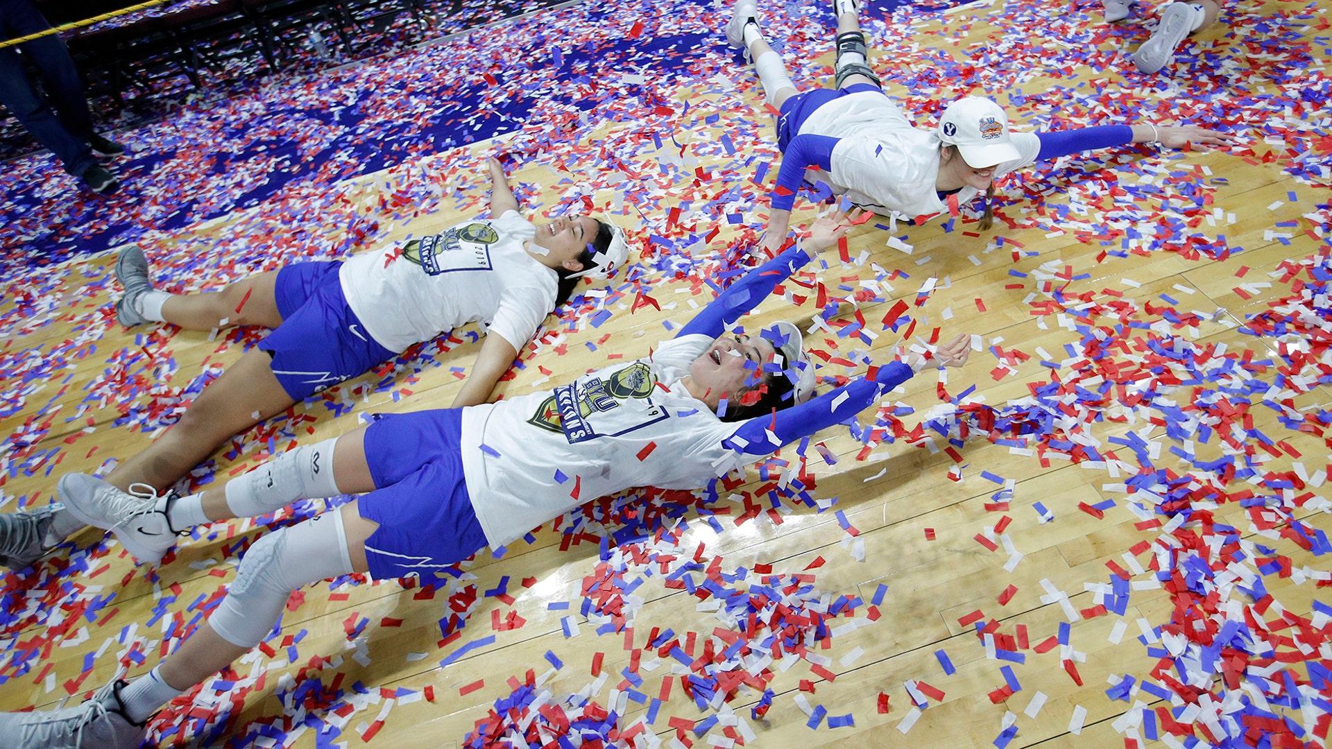 BYU's Shaylee Gonzales and others celebrate after defeating Gonzaga in an NCAA college basketball game for the West Coast Conference women's tournament title, in Las Vegas, March 12, 2019. 