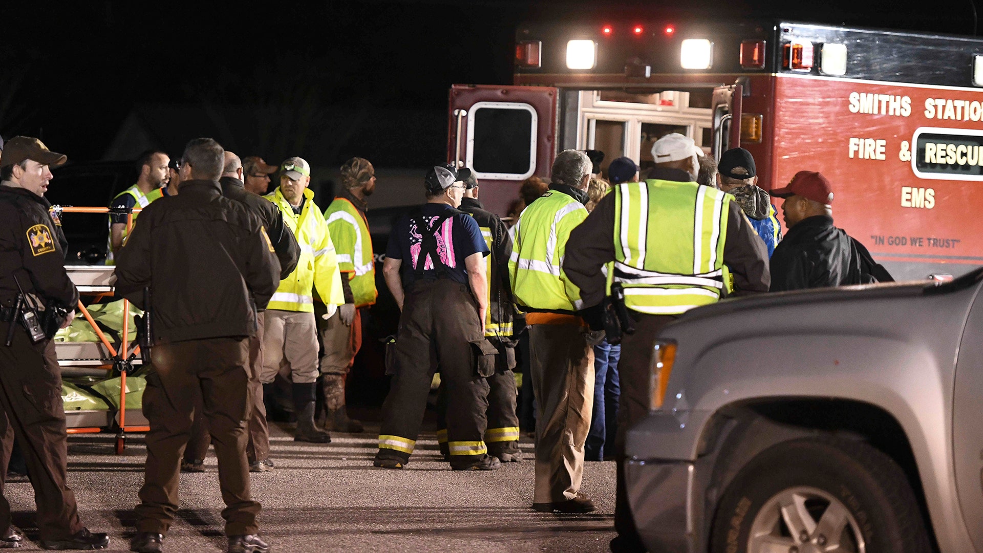 Emergency personnel work the staging area at Sanford Middle School in Beauregard, Ala., Sunday, March 3, after tornados ravaged the area, causing multiple fatalities. 