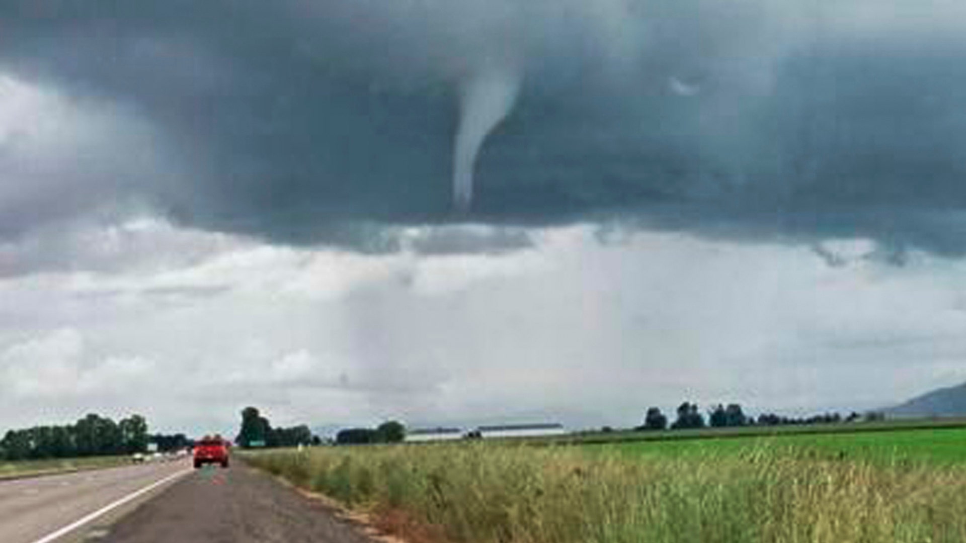 A funnel-shaped cloud forms on I-10 near Marianna, Fla., Sunday, March 3. Numerous tornado warnings were posted across parts of Alabama, Georgia, Florida and South Carolina on March 3 as the powerful storm system raced across the region. 