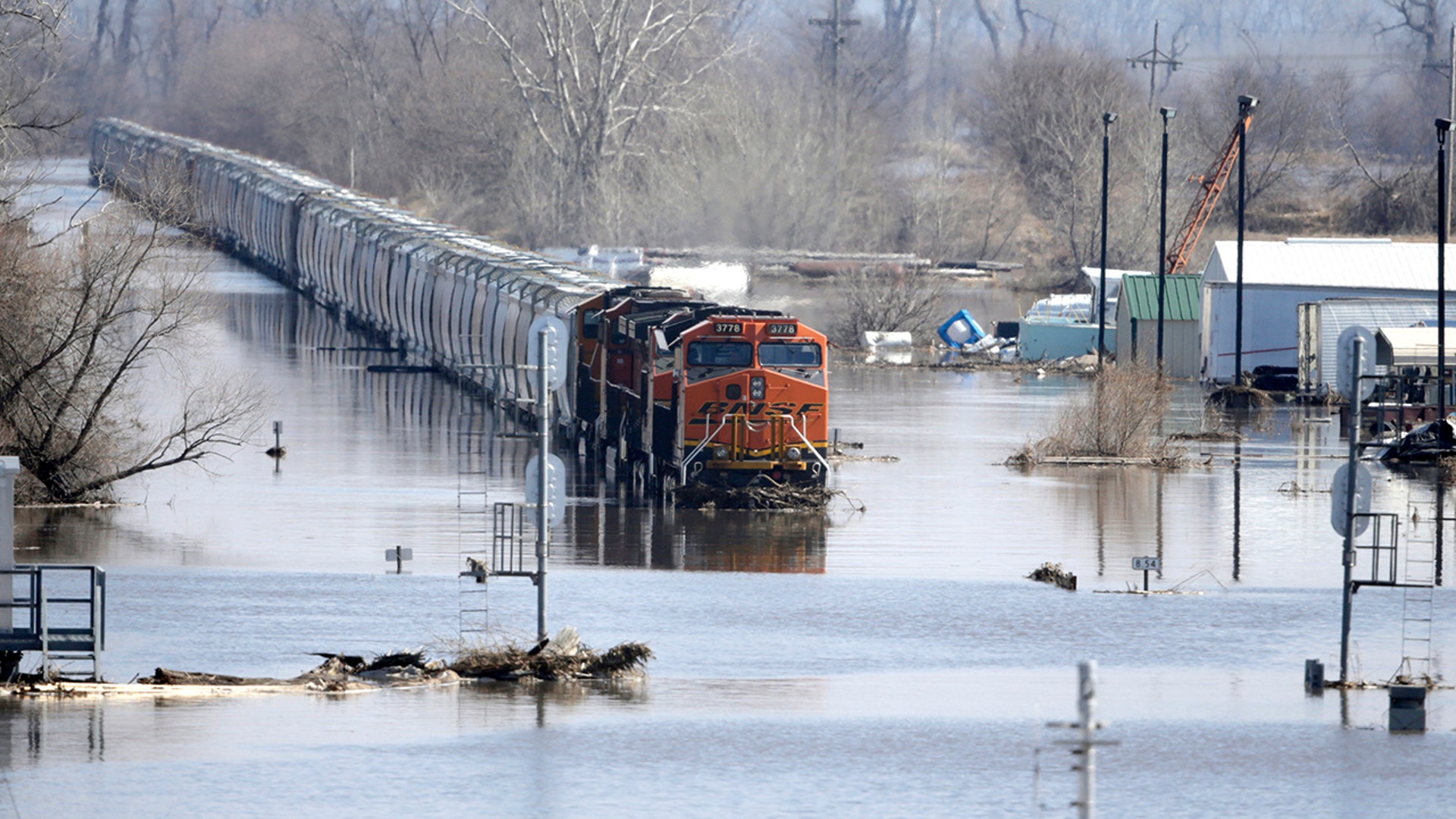 A BNSF train sits in floodwaters from the Platte River, in Plattsmouth, Neb., Sunday, March 17, 2019. Hundreds of people remained out of their homes in Nebraska, but rivers there were starting to recede.