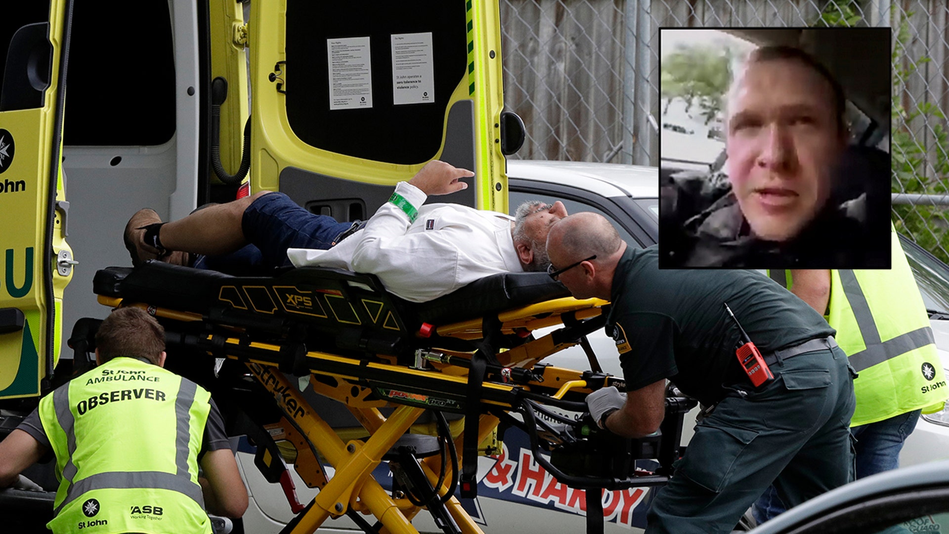 Medics take a man from outside a mosque in central Christchurch, New Zealand, after mass shootings at two mosques full of worshippers attending Friday prayers. (AP Photo/Mark Baker)