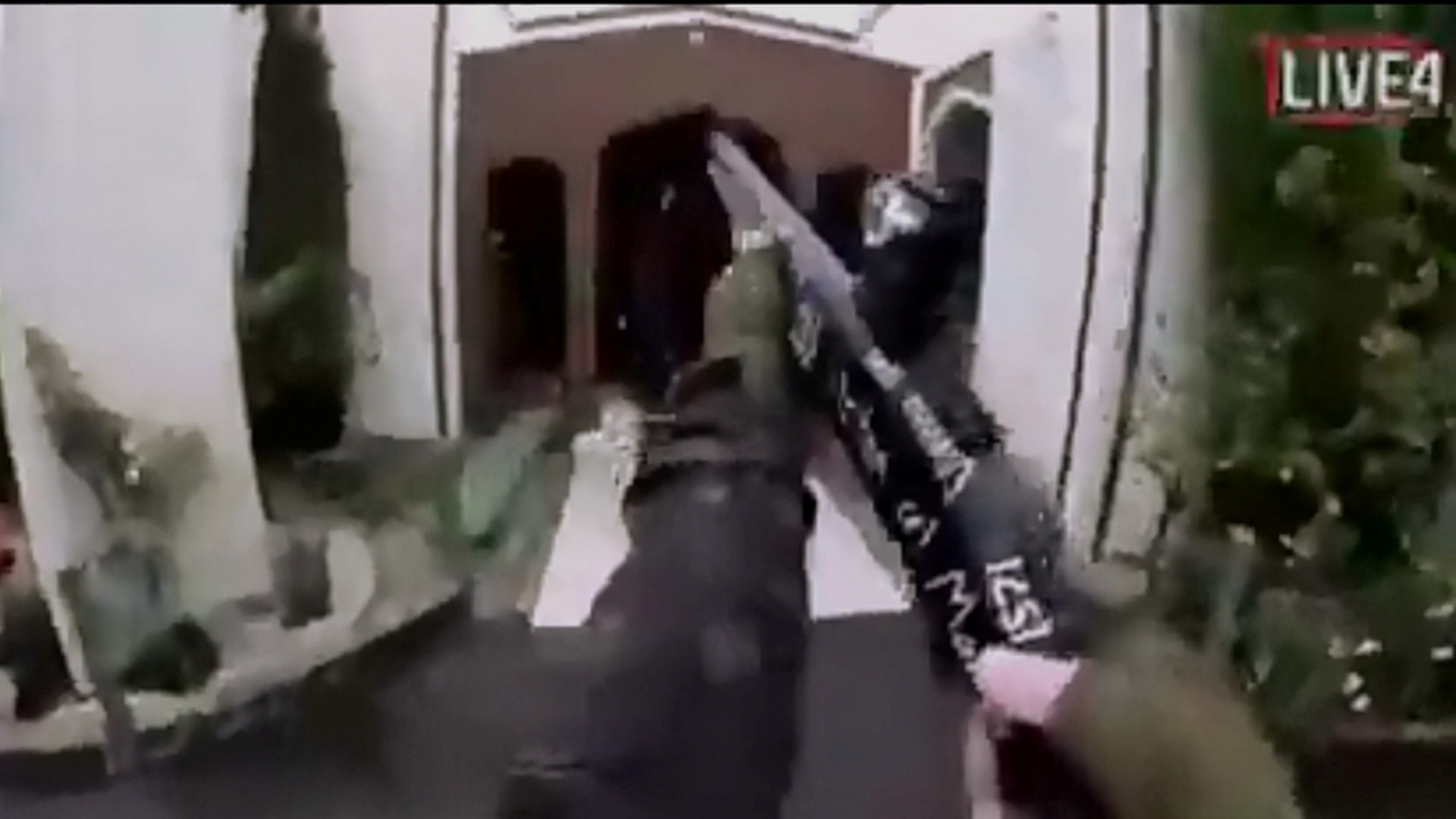 A still image taken from video circulated on social media, apparently taken by a gunman and posted online live as the attack unfolded, shows him entering a mosque in Christchurch,