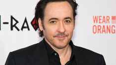 John Cusack films altercation with police in Chicago, says his bike was hit with baton