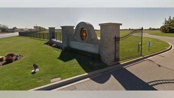 New York woman 'sucked into parents' grave' suing cemetery