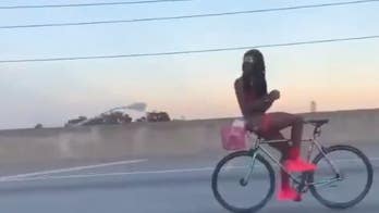 Semi-nude bicyclist riding backwards on Florida highway seen in viral video