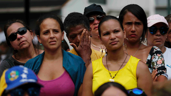 As blackout eases, Venezuela braces for rival rallies