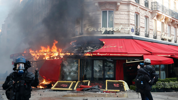 France cleans up Champs-Elysees after yellow vest rioting