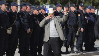 Thousands surround Albania parliament, demand new elections