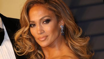 Jennifer Lopez shows off chiseled abs in pink bikini: ‘I’m a hustler baby’